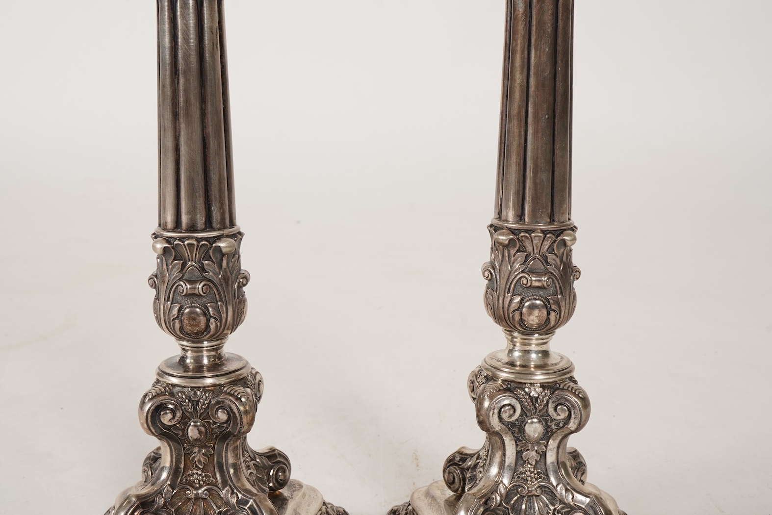A pair of late 18th/early 19th century German white metal candlesticks, maker's mark W.C.H & S
